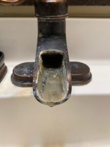 Bathroom sink faucet hard water build up water softener