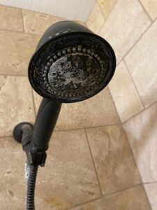 Water softener hard build up on shower head