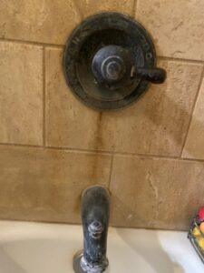 Hard water build up from water softener bathtub shower